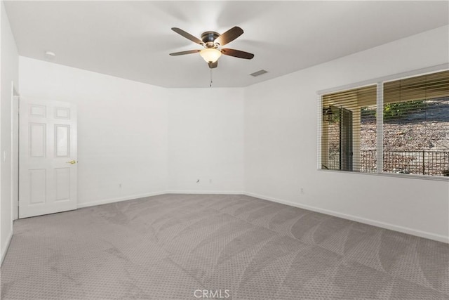 carpeted empty room with ceiling fan