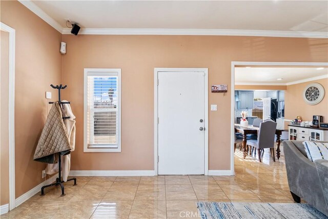 entrance foyer featuring ornamental molding