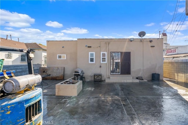 back of house featuring a patio area