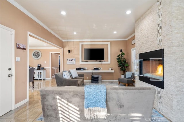 living room featuring crown molding and a fireplace