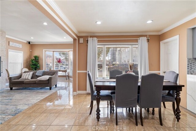 dining area with crown molding