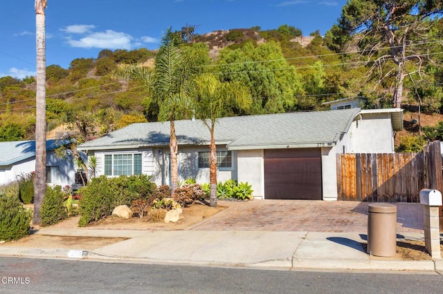 ranch-style home with a garage