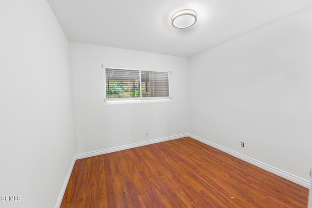 unfurnished room featuring wood-type flooring