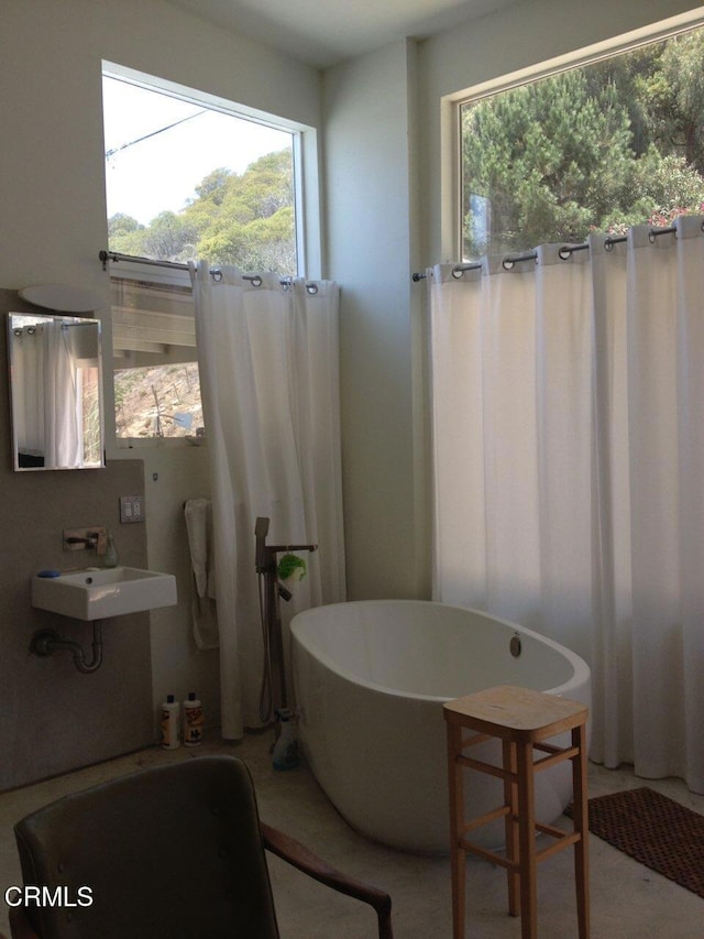 bathroom with a bath and sink