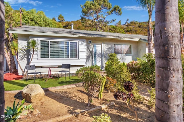 ranch-style home with a front yard