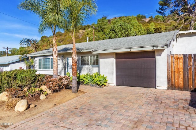 ranch-style home with a garage