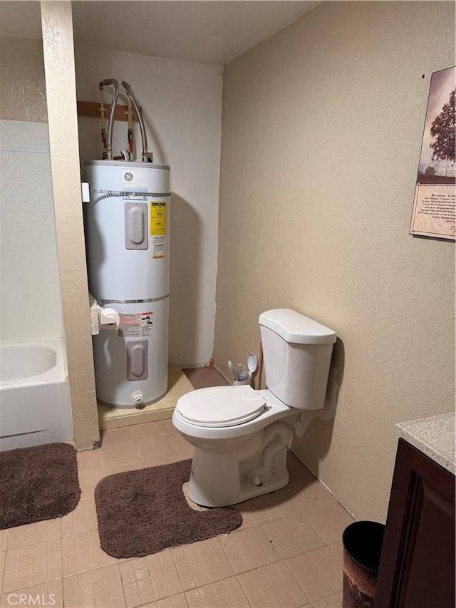 bathroom featuring toilet, vanity, a tub, and secured water heater