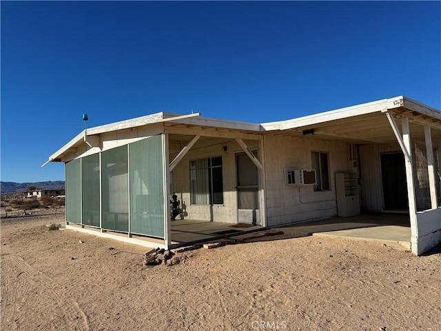 rear view of house with a patio area