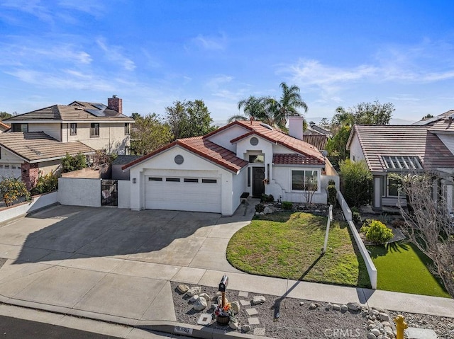 view of front of property with a front lawn, solar panels, and a garage