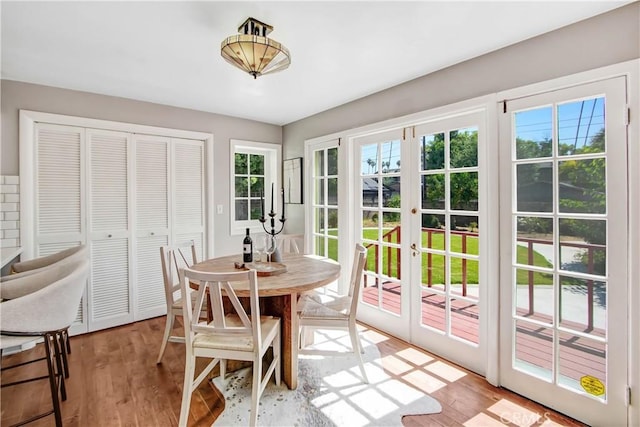 dining room featuring light hardwood / wood-style floors and french doors