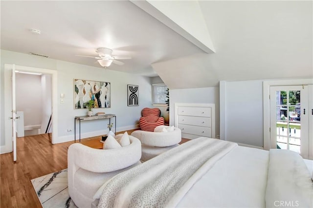 bedroom with access to outside, lofted ceiling, ceiling fan, and hardwood / wood-style flooring