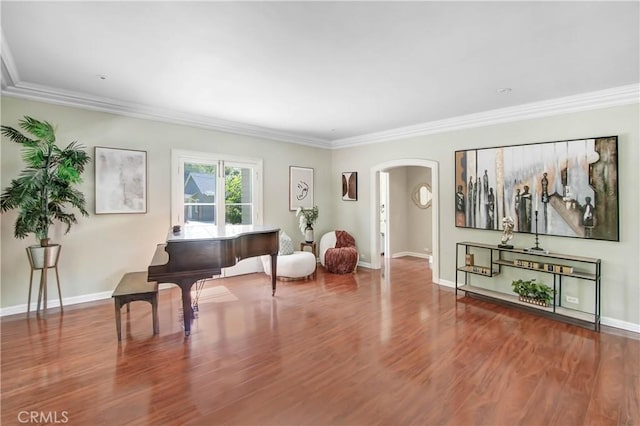 misc room featuring wood-type flooring and crown molding