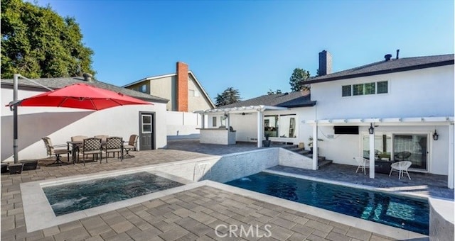 back of house with a patio and a pergola