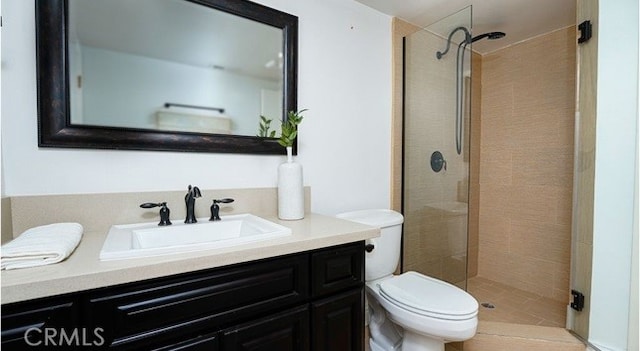 bathroom with walk in shower, vanity, and toilet