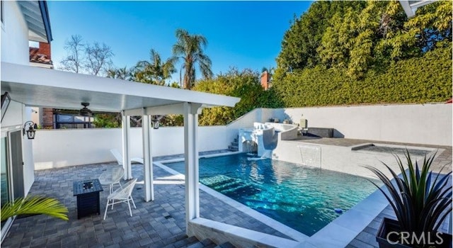 view of pool with ceiling fan and a patio area