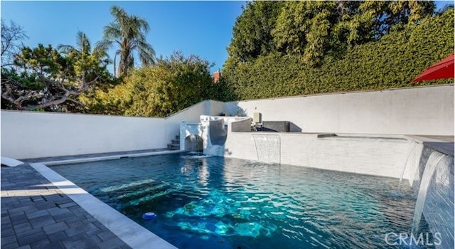 view of pool featuring pool water feature