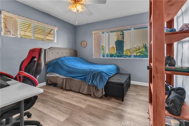 bedroom featuring ceiling fan and light wood-type flooring