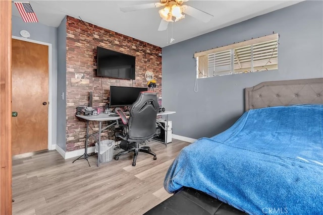 bedroom featuring ceiling fan and wood-type flooring