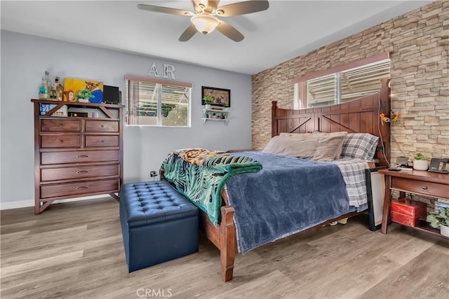 bedroom featuring ceiling fan and light hardwood / wood-style floors