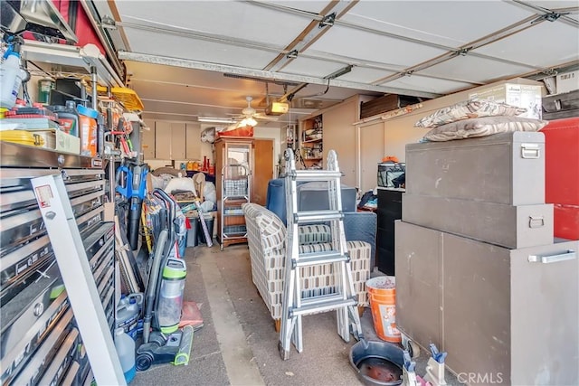 garage featuring ceiling fan and a garage door opener