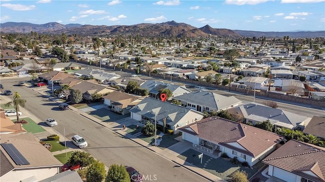 birds eye view of property featuring a mountain view