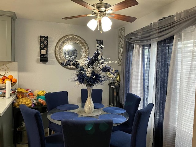 dining space with ceiling fan