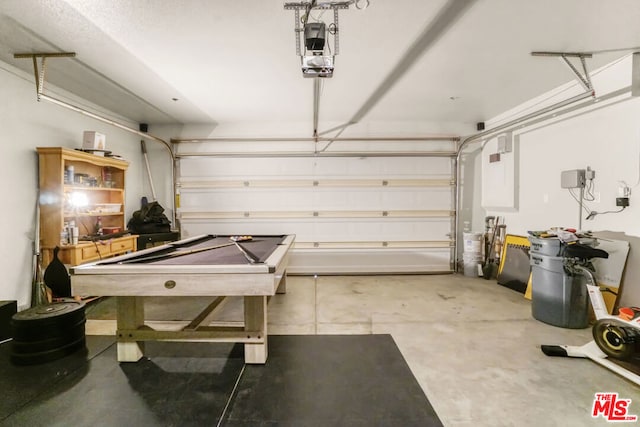 garage featuring a garage door opener