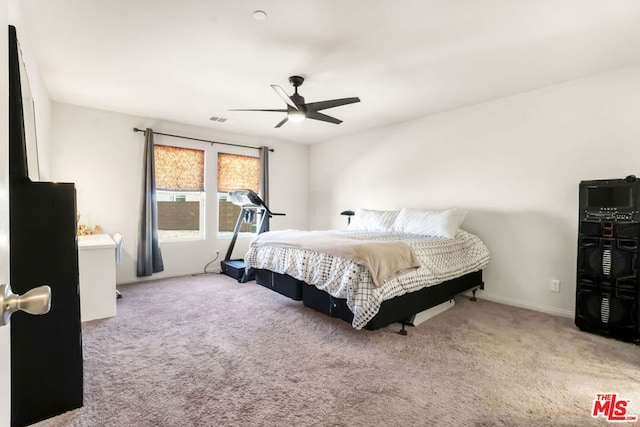 bedroom with light carpet and ceiling fan