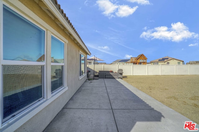 view of home's exterior featuring a patio area