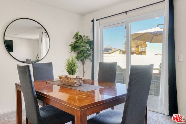 view of carpeted dining area