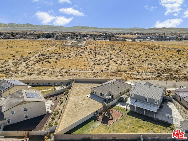 birds eye view of property featuring a mountain view