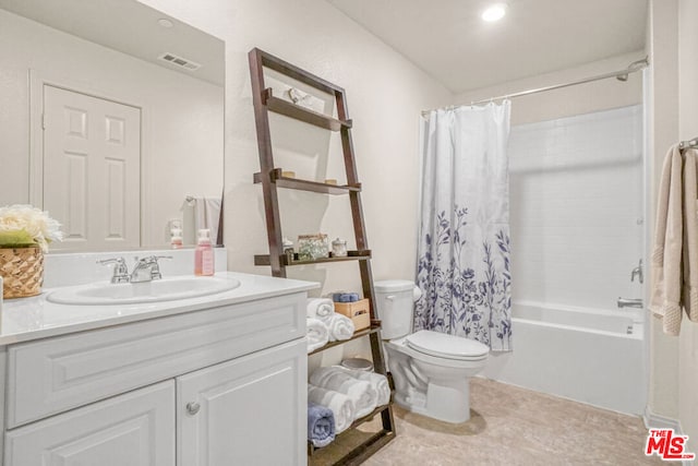 full bathroom with toilet, vanity, and shower / bath combo with shower curtain