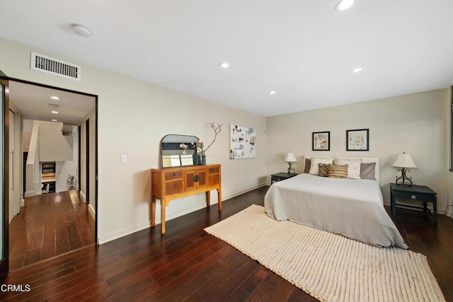 bedroom featuring dark hardwood / wood-style flooring