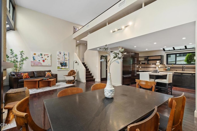 dining room with dark wood-type flooring and sink