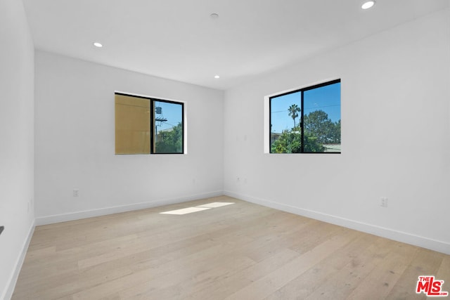 unfurnished room featuring light wood-type flooring