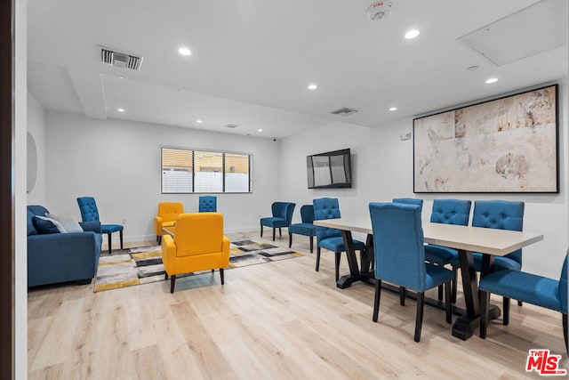 dining space with light hardwood / wood-style floors