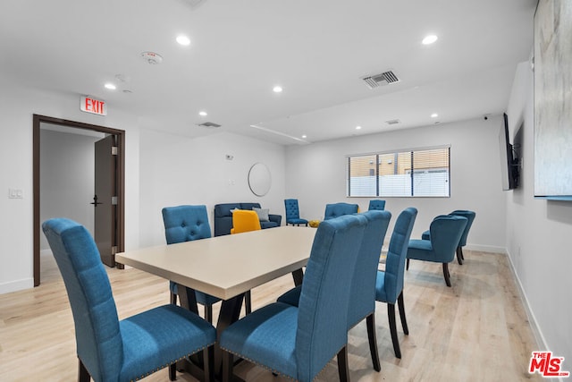 dining space with light wood-type flooring