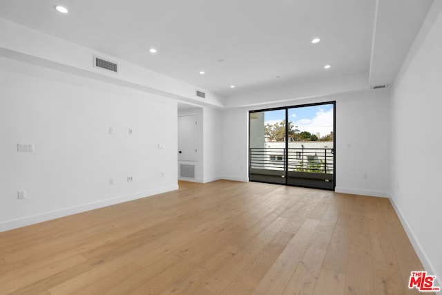 unfurnished room featuring light wood-type flooring