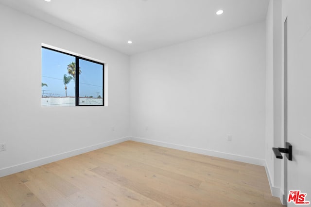 unfurnished room featuring light wood-type flooring