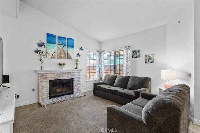 carpeted living room featuring lofted ceiling and a brick fireplace