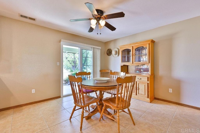 dining room featuring ceiling fan and light tile patterned flooring