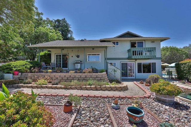 view of front of home with a balcony