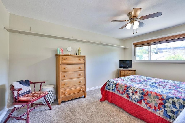 bedroom featuring ceiling fan and carpet floors