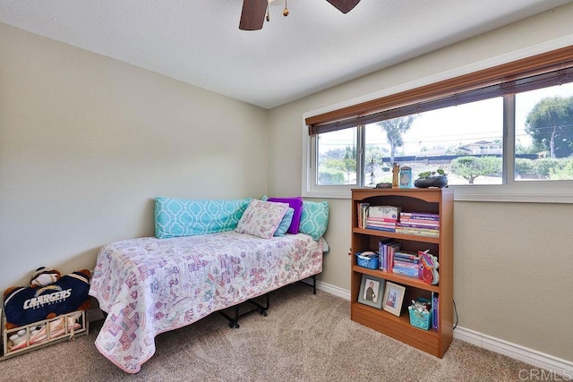 carpeted bedroom featuring ceiling fan