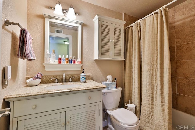 full bathroom with toilet, shower / bath combination with curtain, and vanity