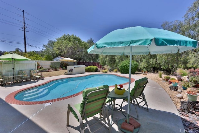 view of swimming pool with a patio area