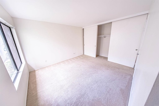 2374 Caringa Unit B, Carlsbad, CA 92009 - unfurnished bedroom with light carpet and a closet