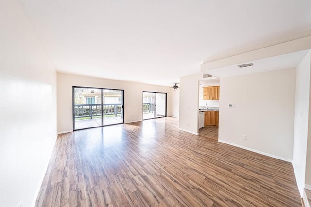 2374 Caringa Unit B, Carlsbad, CA 92009 - empty room with light hardwood / wood-style floors, ceiling fan, and sink