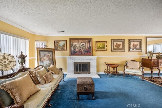 carpeted living area with crown molding, a brick fireplace, visible vents, and a textured ceiling