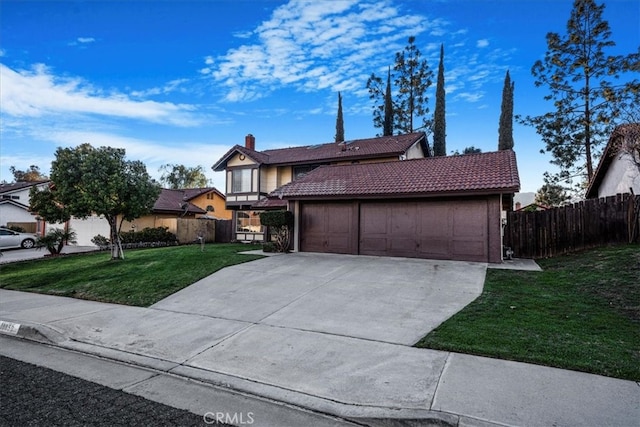 view of front of property with a front yard, fence, driveway, a garage, and a tile roof